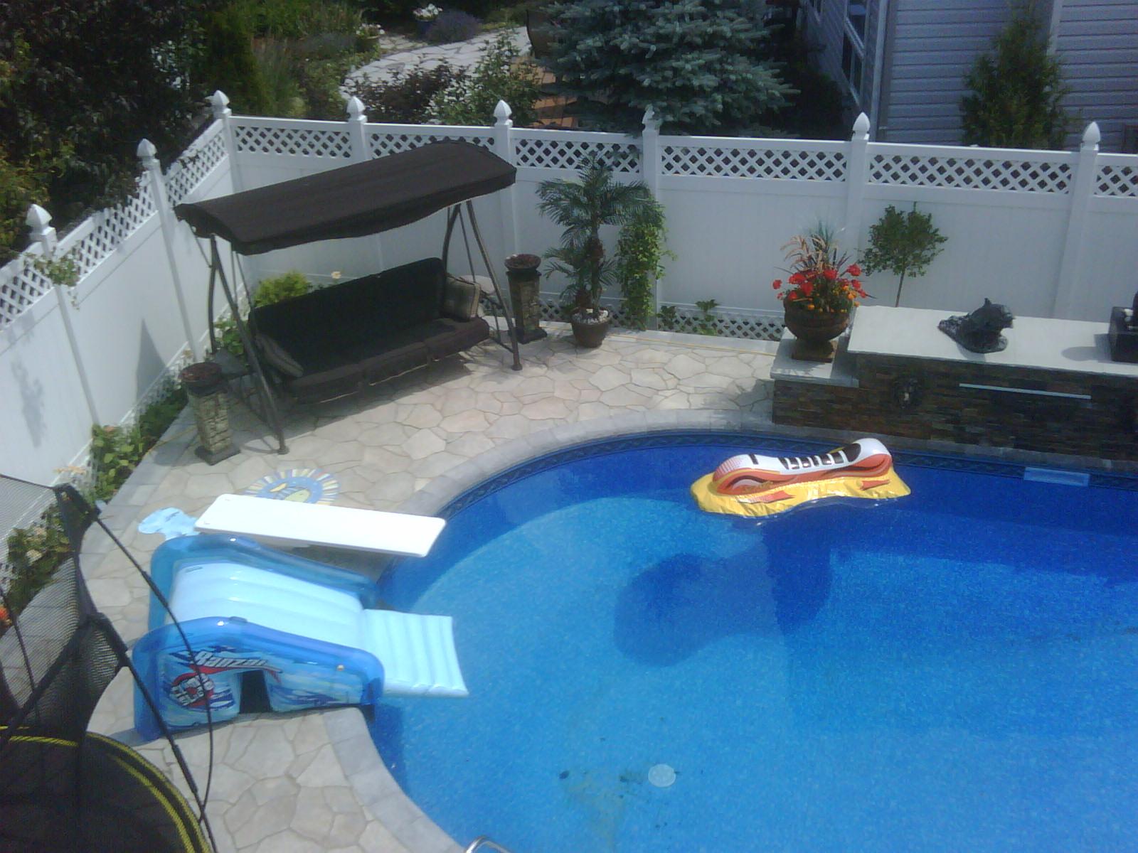 A seating corner, curved pool edge and surrounding patio.